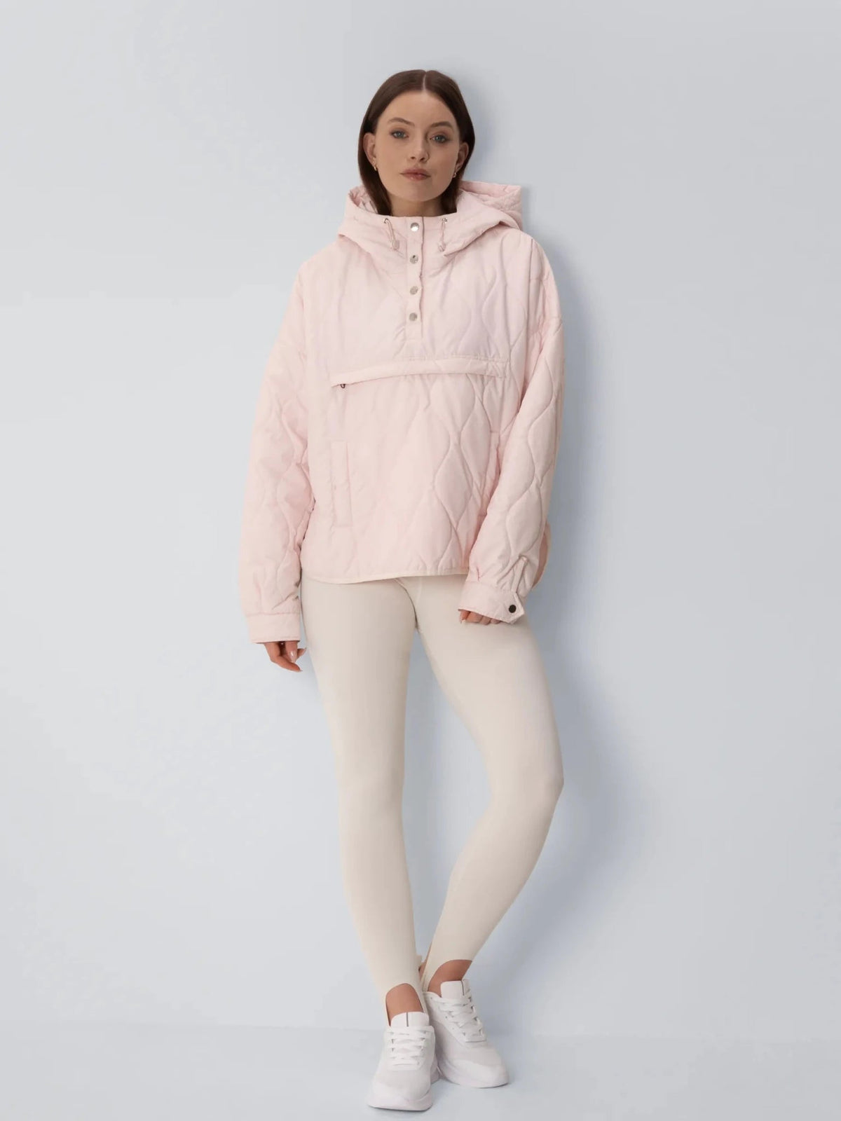 Unisex packable quilted puffer hoodie in pale pink