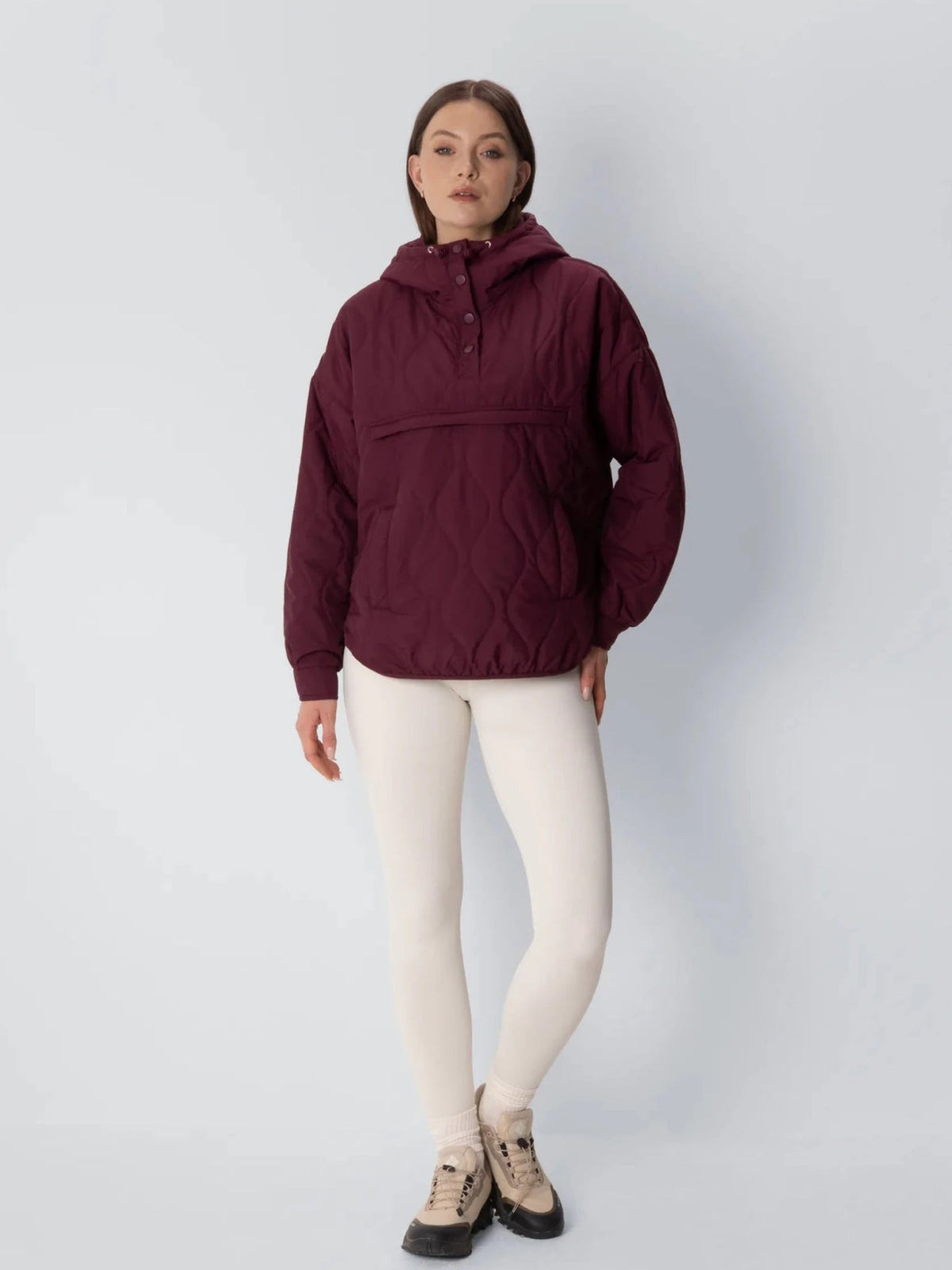 Unisex packable quilted puffer hoodie in burgundy